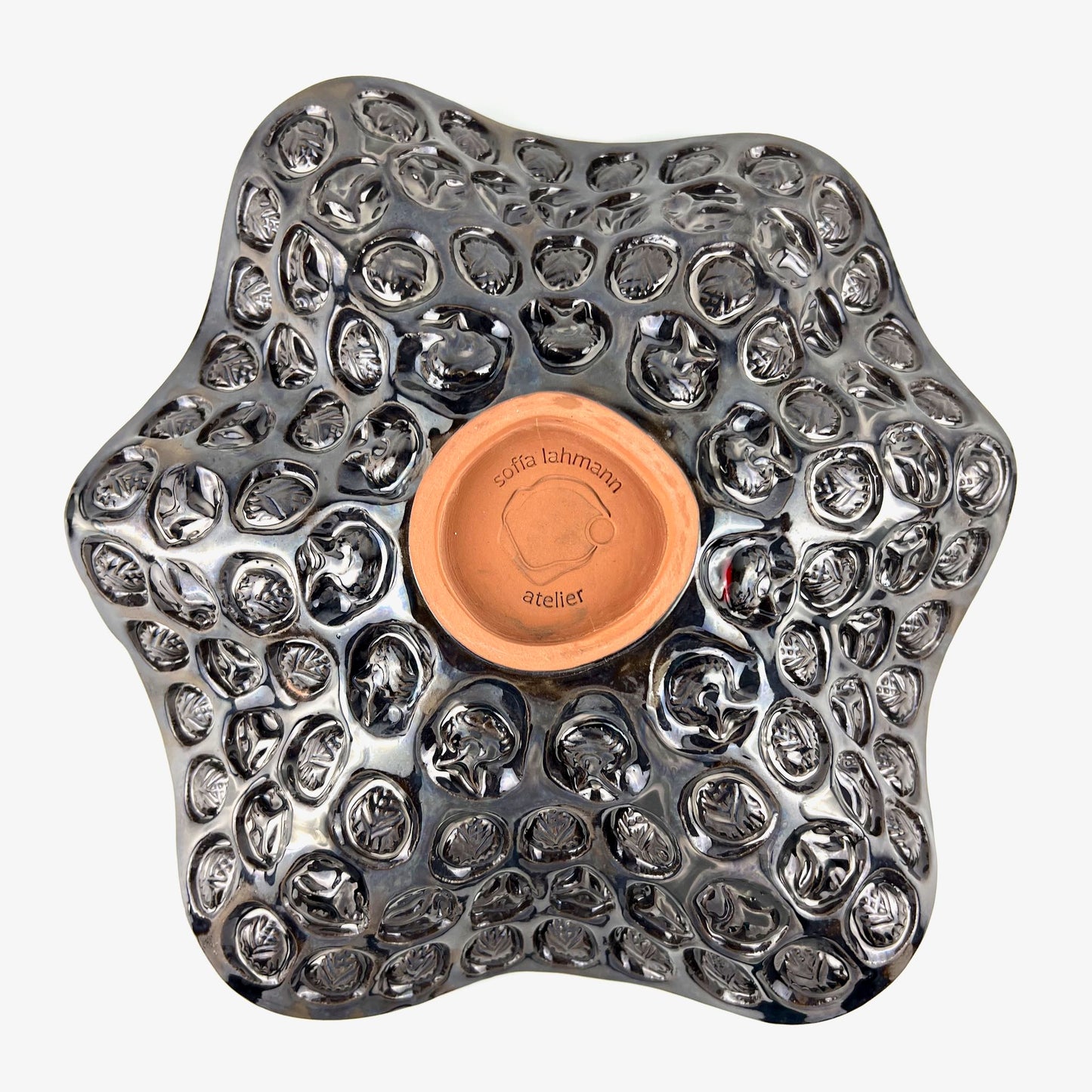 Top view of the textured tree, ant, and beetle exterior with dark metallic glaze on a handmade large-sized ceramic bowl.
