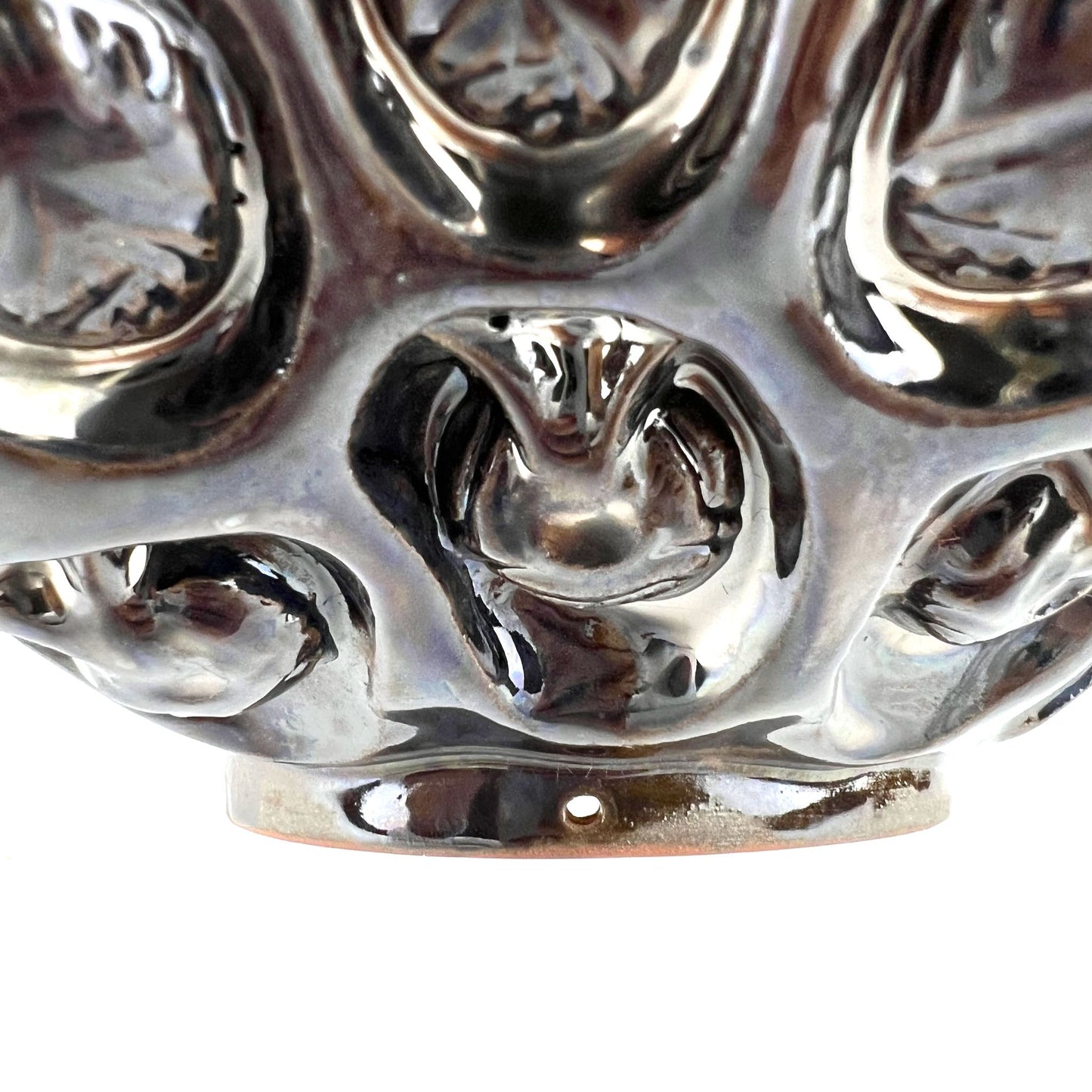 Close-up of the foot rim on a handmade large-sized ceramic bowl, showcasing its ability to become wall art.