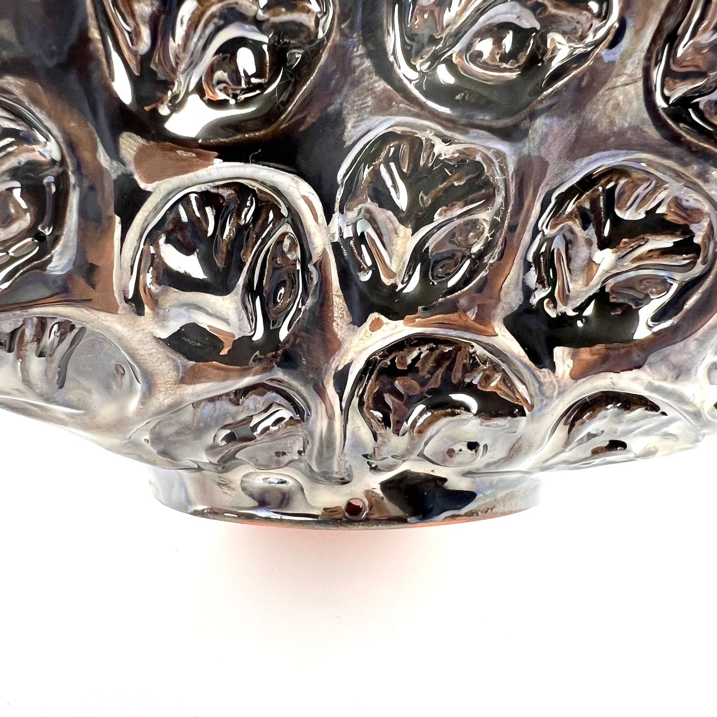 Close-up of the foot rim on a handmade medium-sized ceramic bowl, showcasing its ability to become wall art.