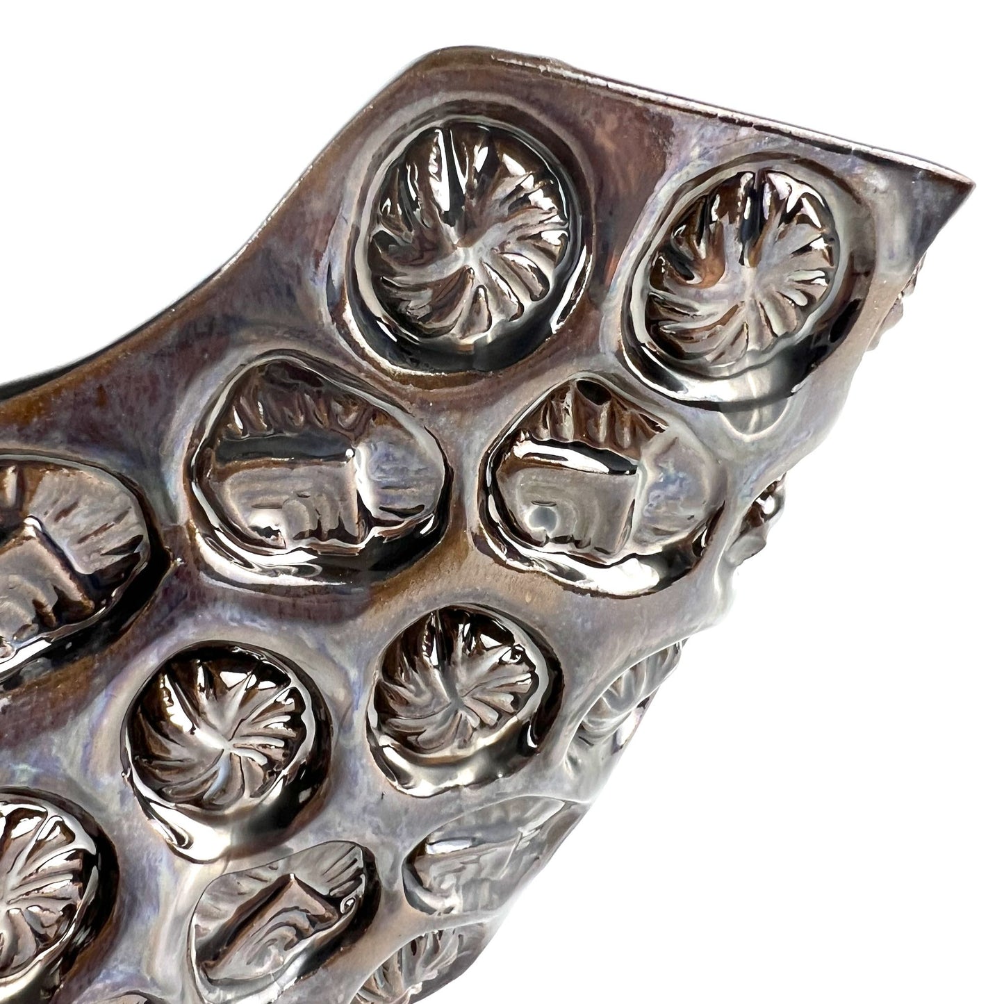 Close-up of the textured sunshine exterior with dark metallic glaze on an extra-large handmade ceramic bowl.