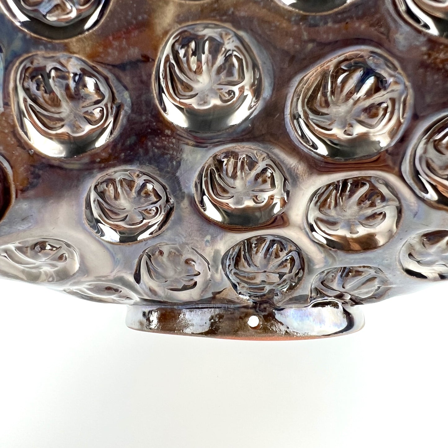 Close-up of the foot rim on a handmade medium ceramic bowl, showcasing its ability to become wall art.