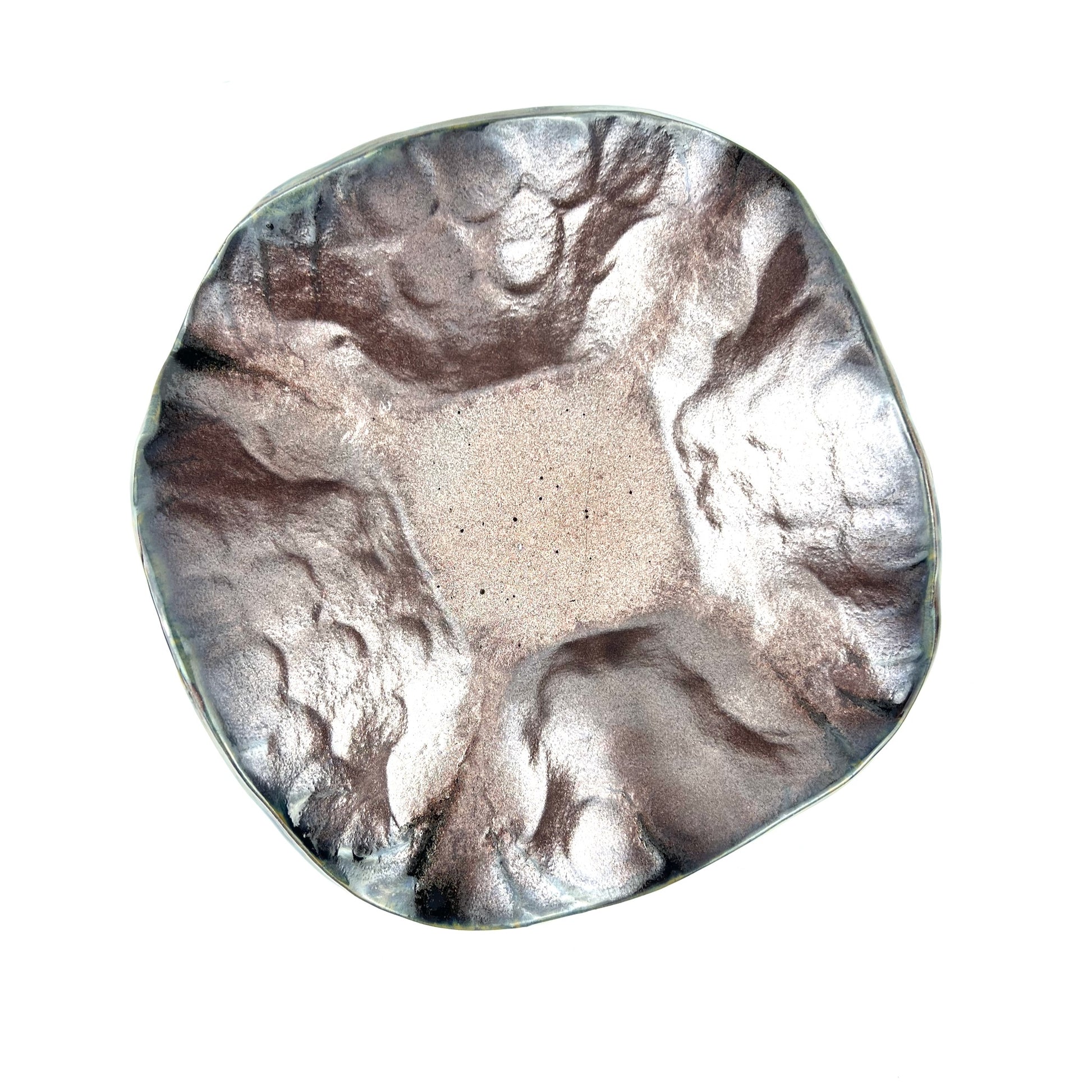 Top view of the shimmering rose gold interior of a handmade medium ceramic bowl.