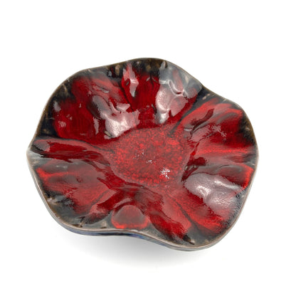 Handmade medium-sized decorative ceramic bowl with a glossy rich red interior and textured beetle design.