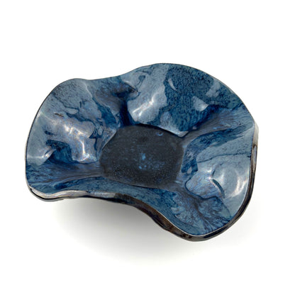 Handmade small decorative ceramic bowl with a royal blue interior and textured Trio of Leaves design.