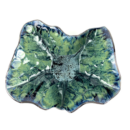 Top view of the glossy cornflower blue interior with navy, seafoam, and lime green accents of a handmade extra-large ceramic bowl.